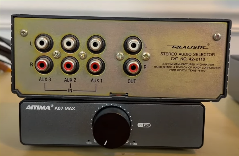 Rear view of a Realistic Stereo Audio Selector with multiple AUX inputs and outputs. 