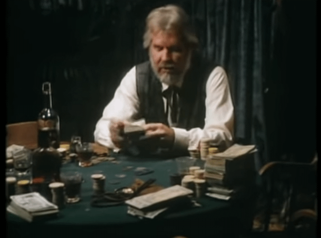 A person sitting at a table with a stack of cards

AI-generated content may be incorrect.