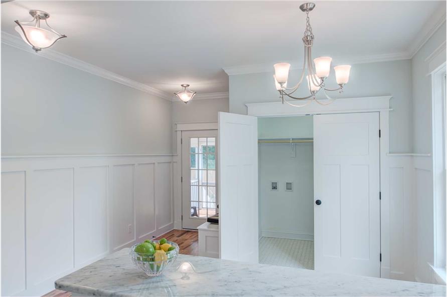 A white double door across the snack bar opens to the utility room.
