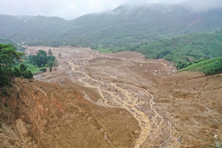 AThis aerial view shows the landslide site in the remote mountainous village of Lang Nu, in Lao Cai province on September 11, 2024, in the aftermath of Typhoon Yagi hitting northern Vietnam. A lands