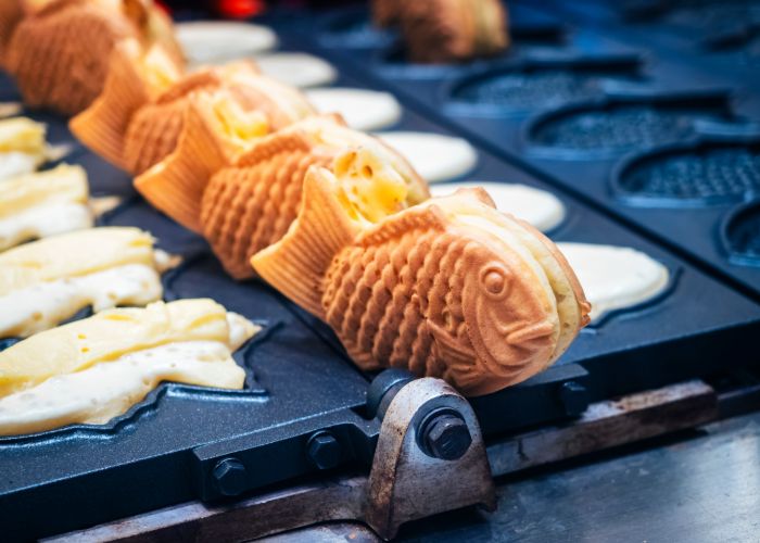 Fresh taiyaki being cooked on a special grill