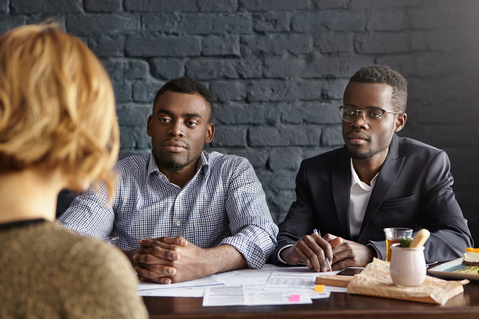 Two interviewers talking to a candidate