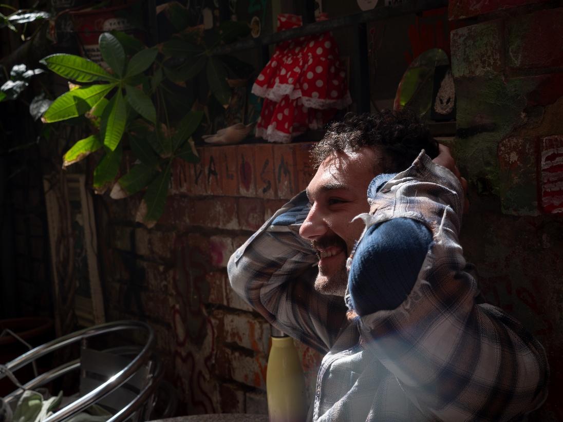 A person smiling with his hands behind his head

AI-generated content may be incorrect.