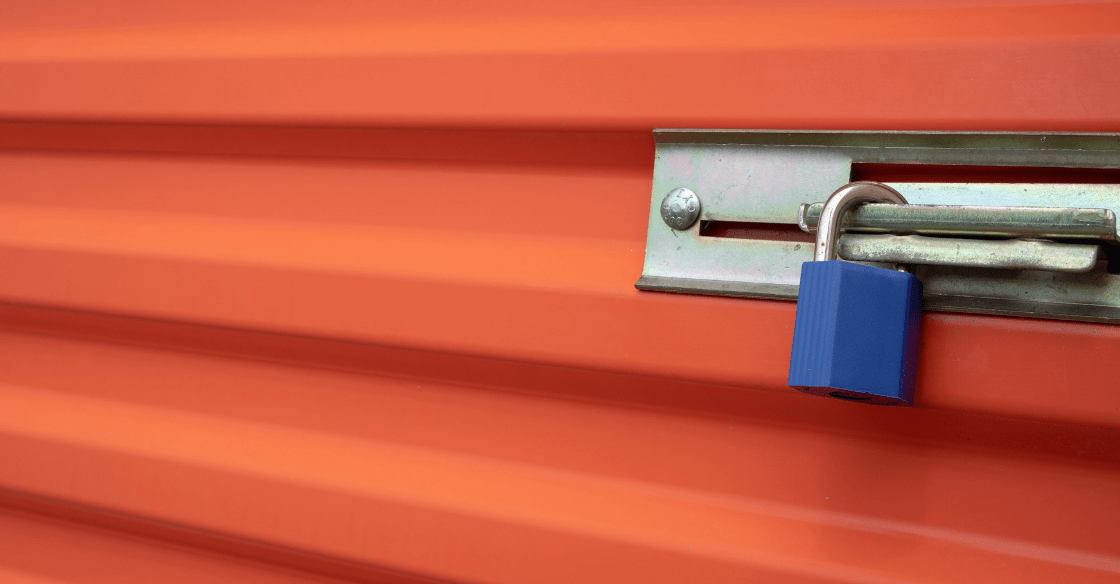 Blue lock on a secure self-storage unit door demonstrates the high security of Storage Locker’s facilities.