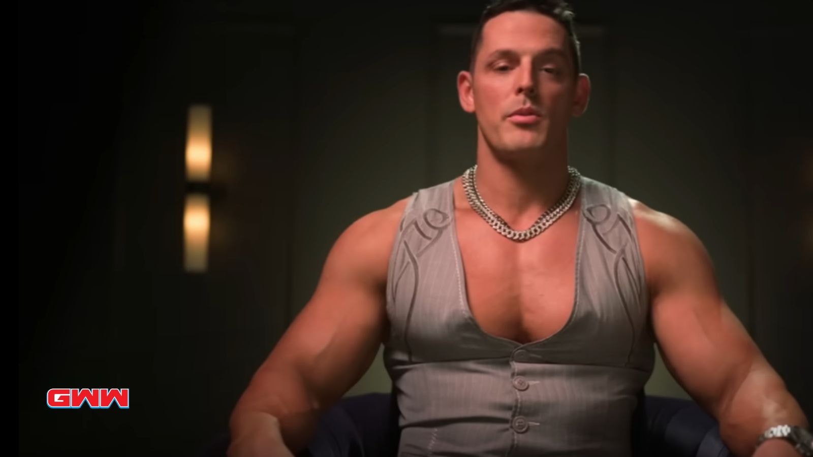 Jessie Godderz in a sleeveless vest speaking to the camera.