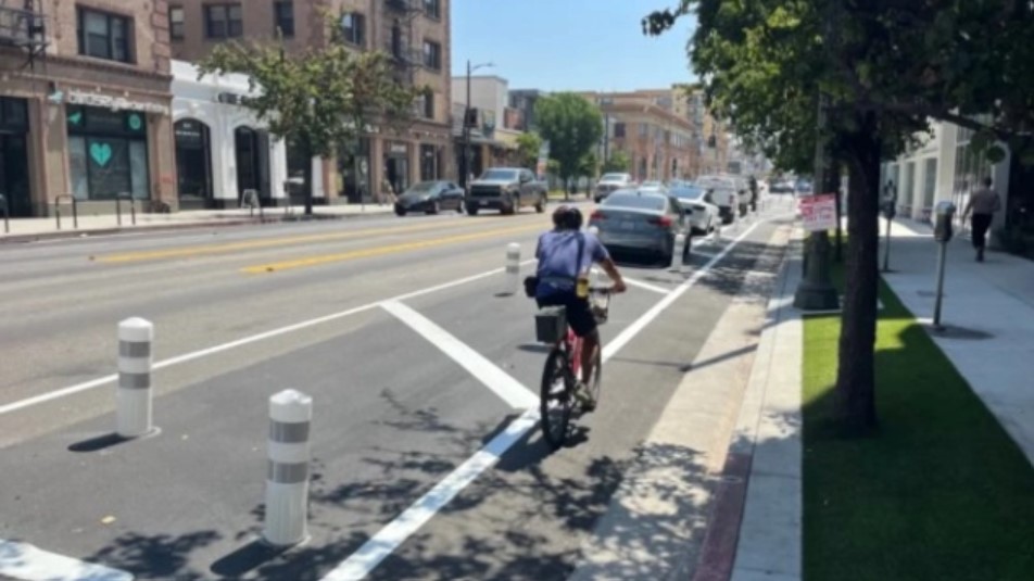 Person riding bicycle in newly design bike lane