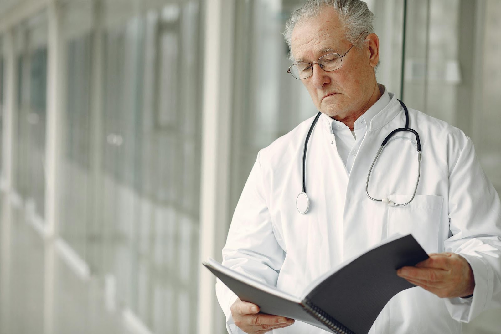 A doctor studying a report | Source: Pexels