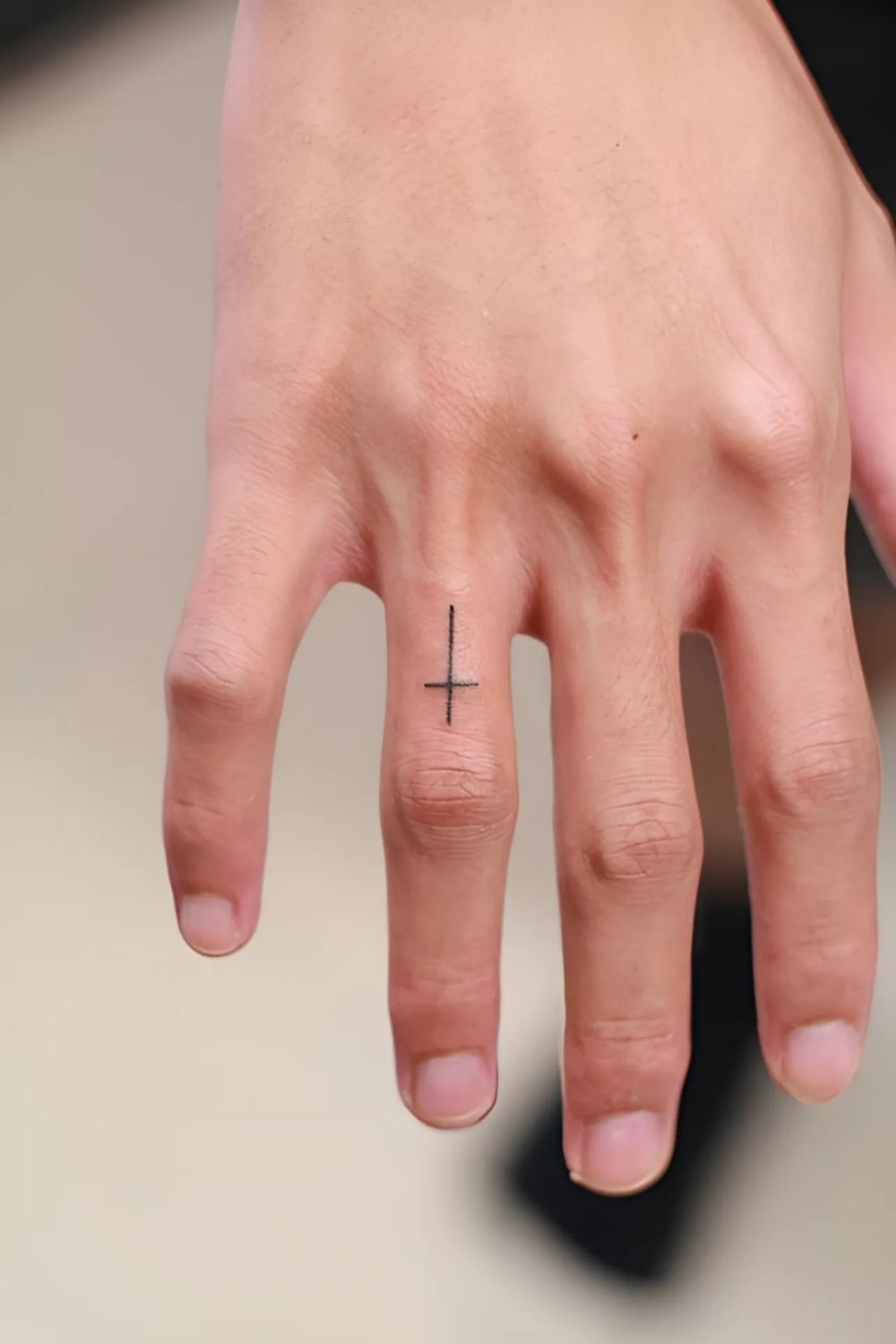 Cross Finger Tattoo