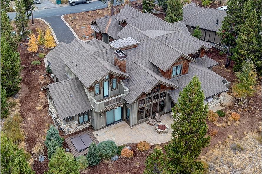 Rear aerial view of the two-story country home.