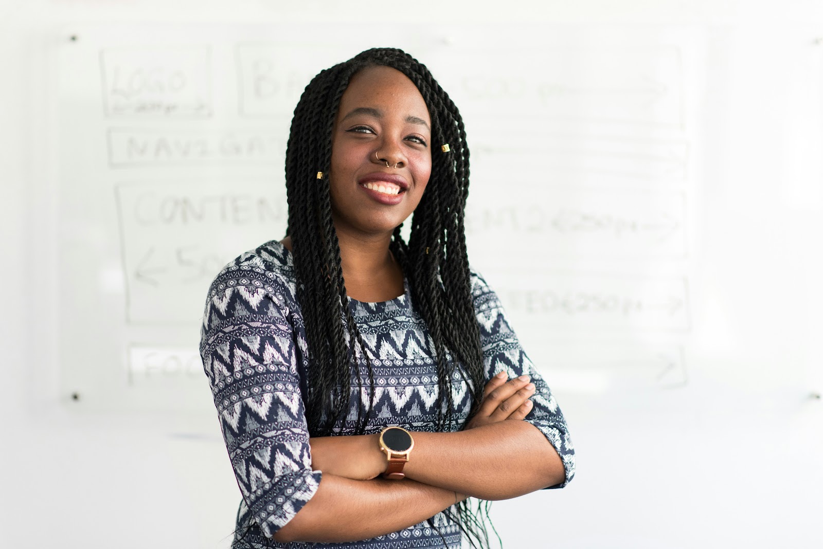 A woman posing for a headshot in front of a white background