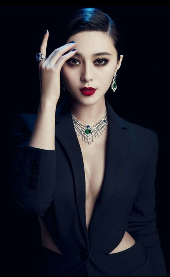 A photo of Fan Bingbing wearing a dark navy blue jumpsuit 