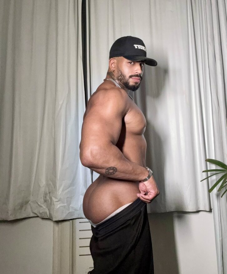 Lipe Scorpio shirtless pulling up his pants revealing this thick shaved gay bubble butt ready to take massive gay dick