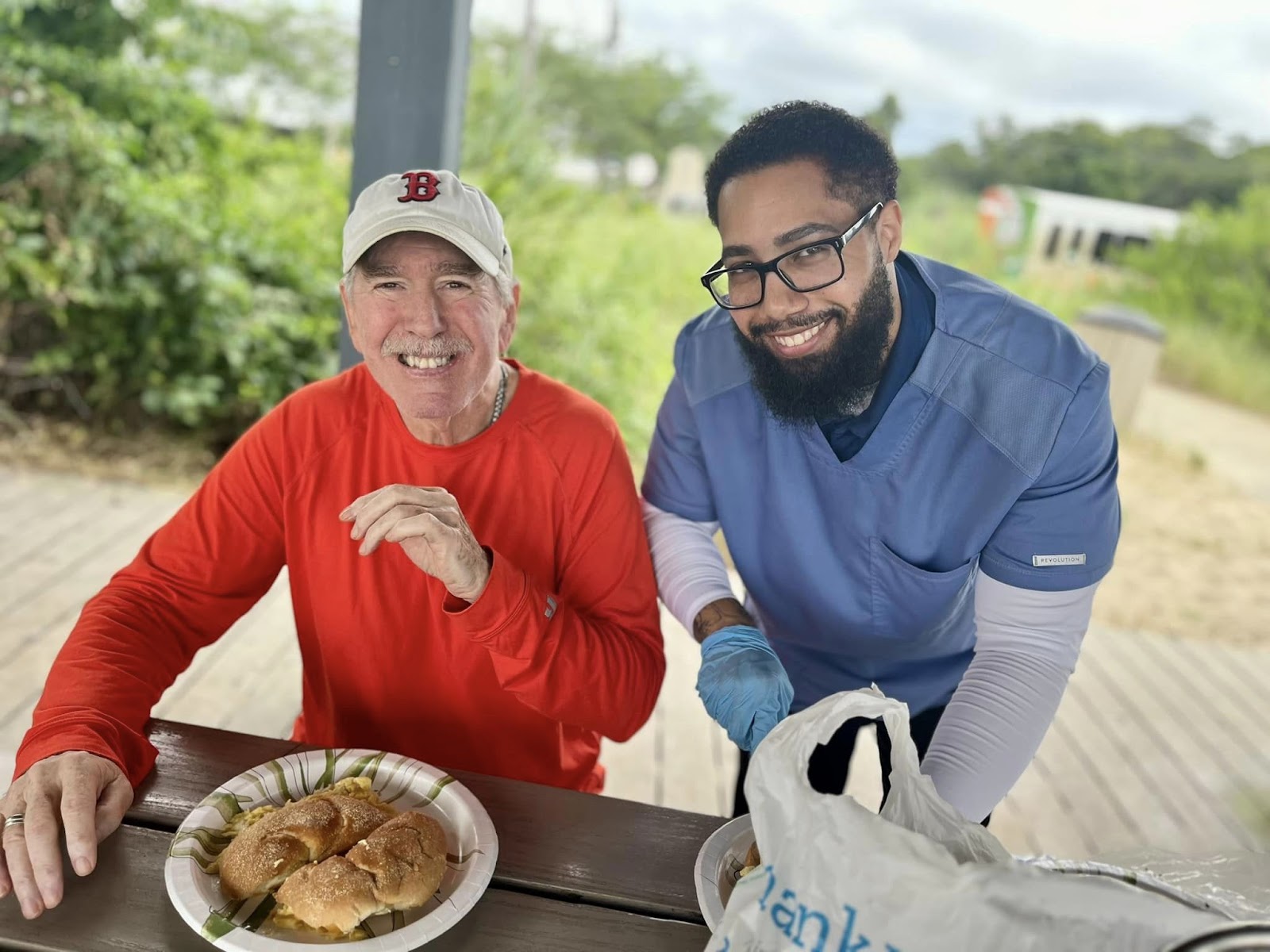 An assisted living resident smiling with a caregiver