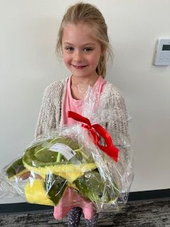 Clara holding a prize
