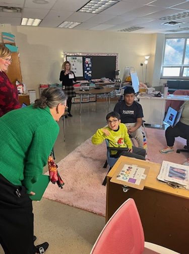 Dr. Reid speaking with a student at Poplar Tree Elementary School.