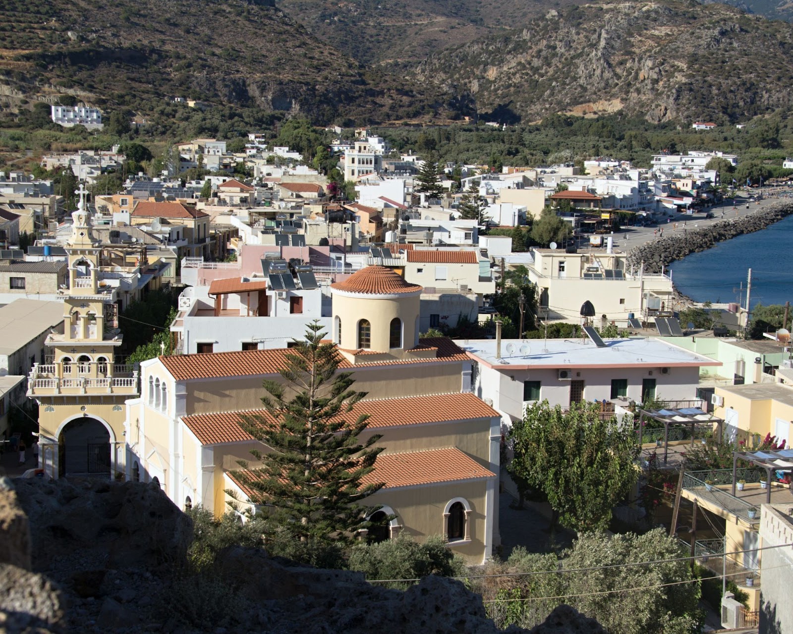 A top view of Paleochora showing buildings along the coastline.