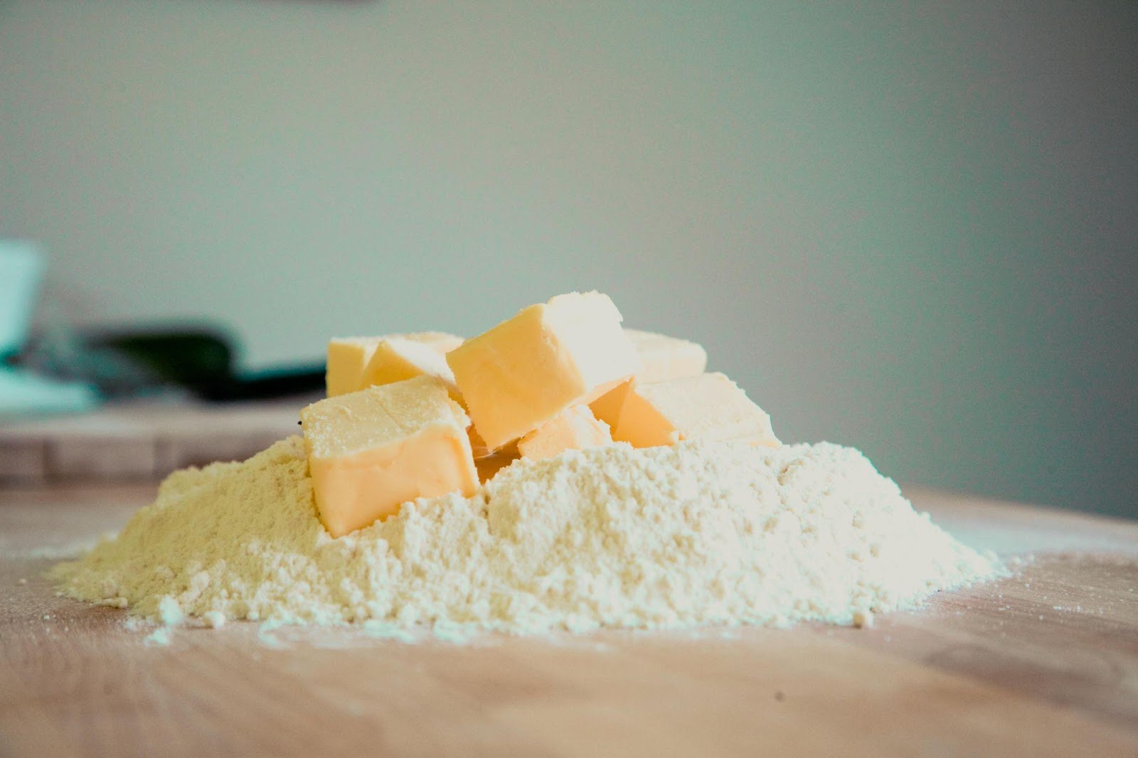 Butter cubes on a table mixed with flour