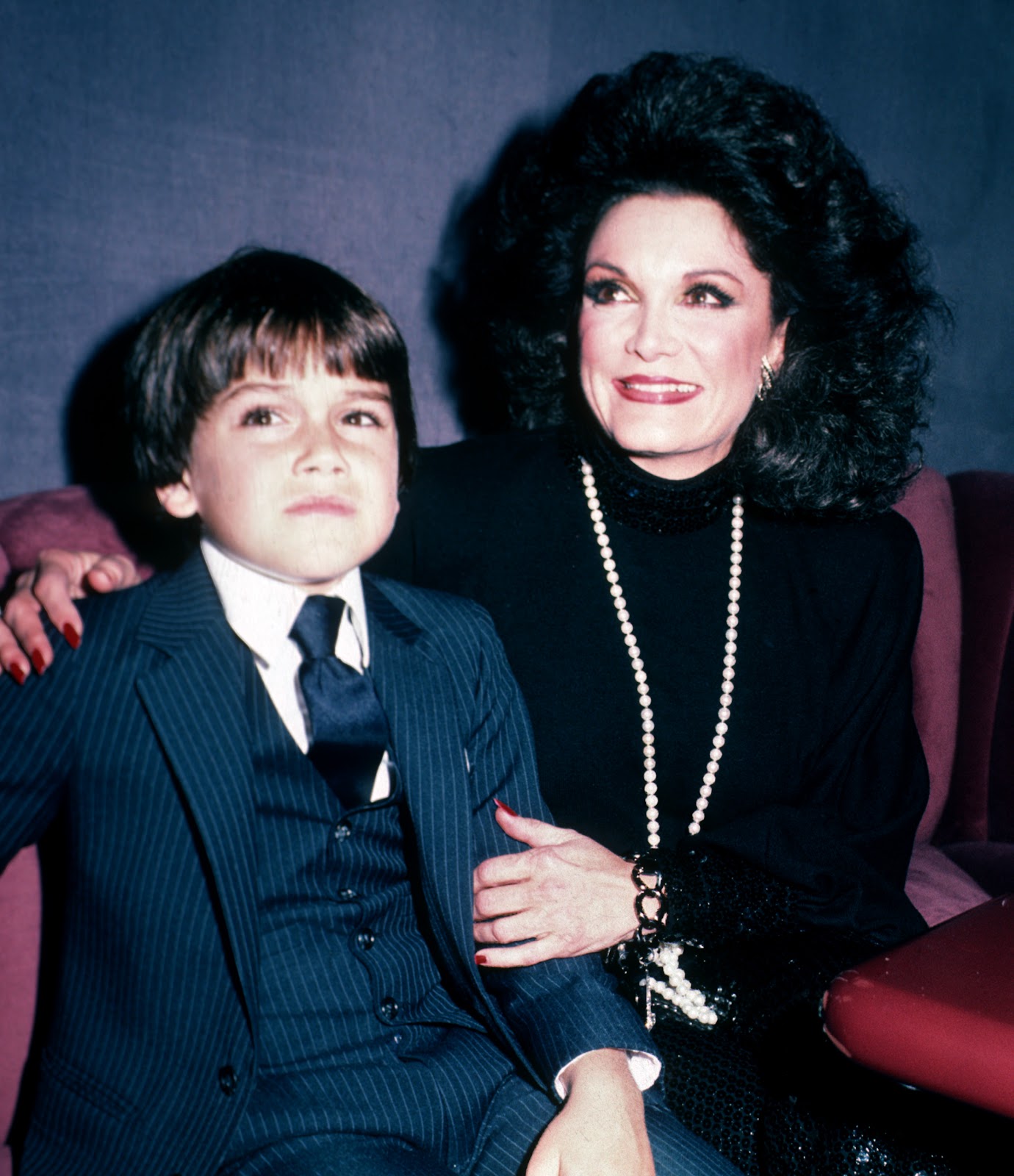 Joseph "Joey" Garzilli with his mother at the book party for "Who's Sorry Now?" on October 9, 1984, in New York City | Source: Getty Images