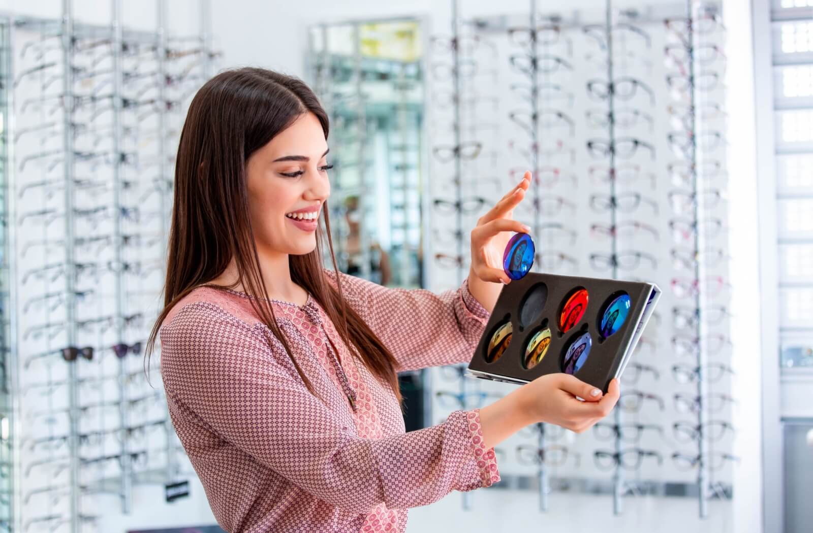 An eye doctor shares samples of different polarized lens options.