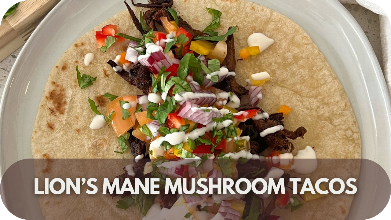 Plant-based Lion’s Mane mushroom tacos with avocado, salsa, and fresh coriander on a wooden platter