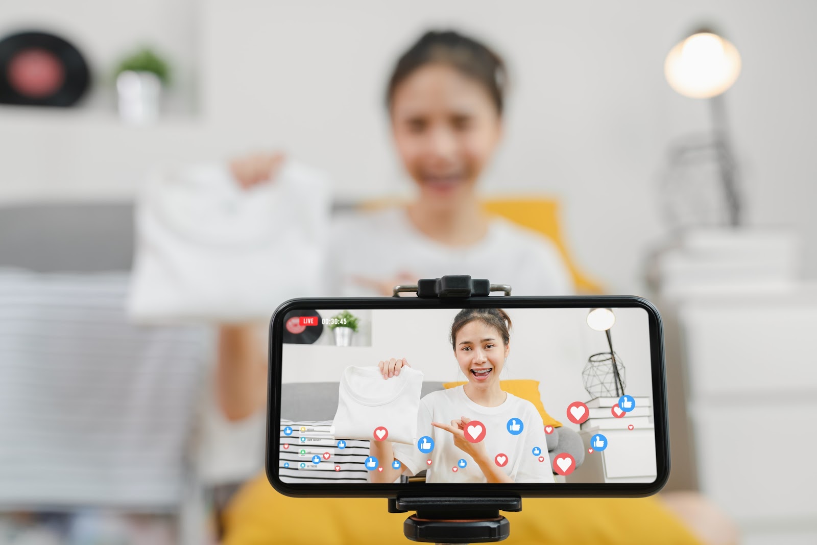 Social commerce: A woman doing livestreaming to sell products.