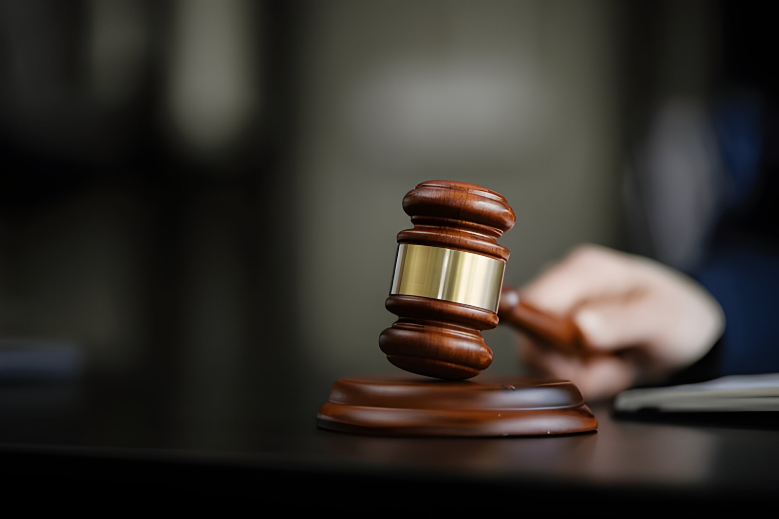 Judge's gavel in a courtroom setting, representing the legal aspects and compliance challenges accountants face when handling international tax issues.