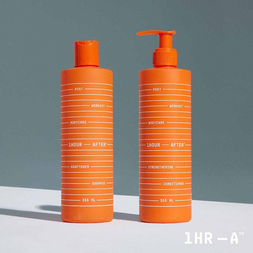 1Hour After Adaptogen Shampoo and Strengthening Conditioner in sleek orange bottles, standing against a neutral background.