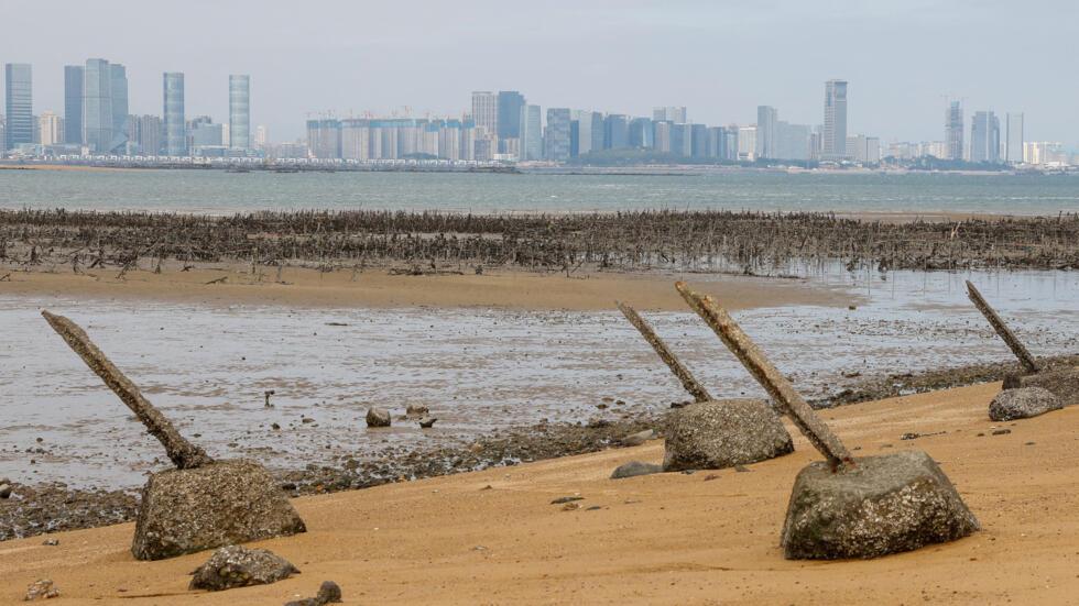 Anti-landing barricades are seen on the beach with China's Xiamen in the background in Kinmen, Taiwan December 18, 2023.