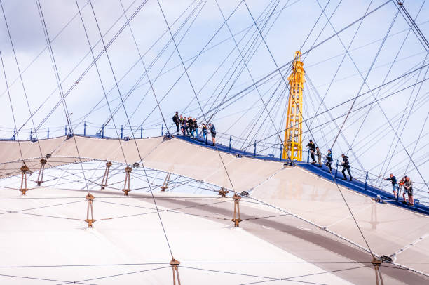 people climbing the o2 arena in London