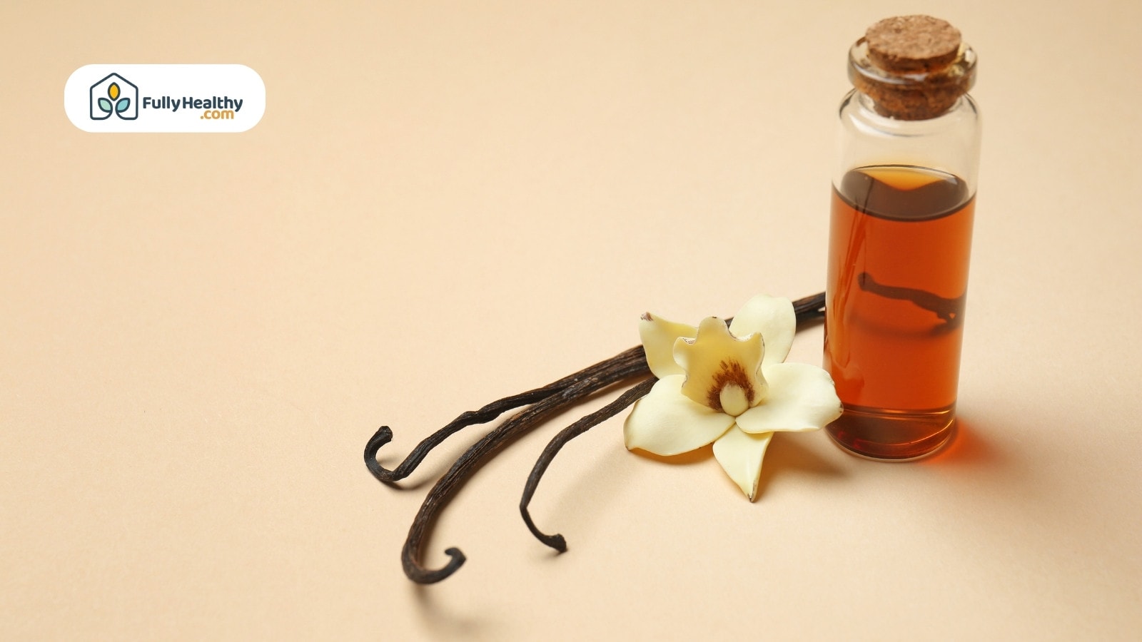 Vanilla extract bottle with vanilla beans and flower on beige background