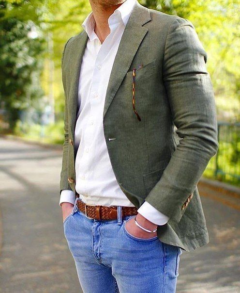  man wearing a green suit looking smart in a professional photo 