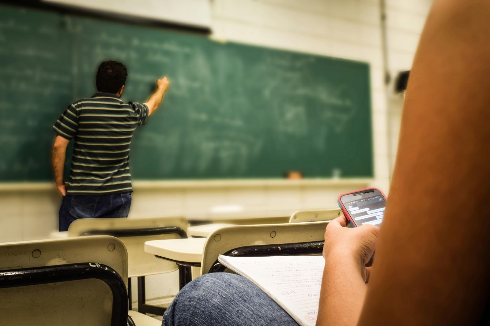 A student using a phone in class