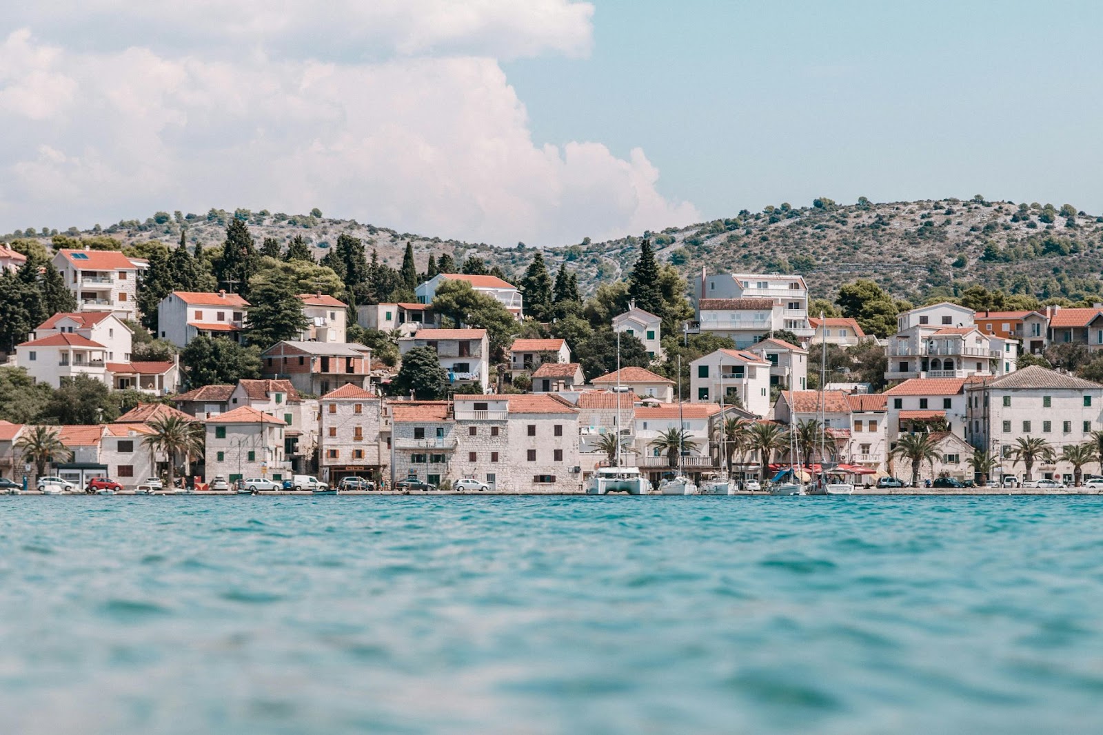 Coastal village along the Dalmatian coast in Croatia, with stone houses by the Adriatic Sea – a favorite stop for yacht charters.