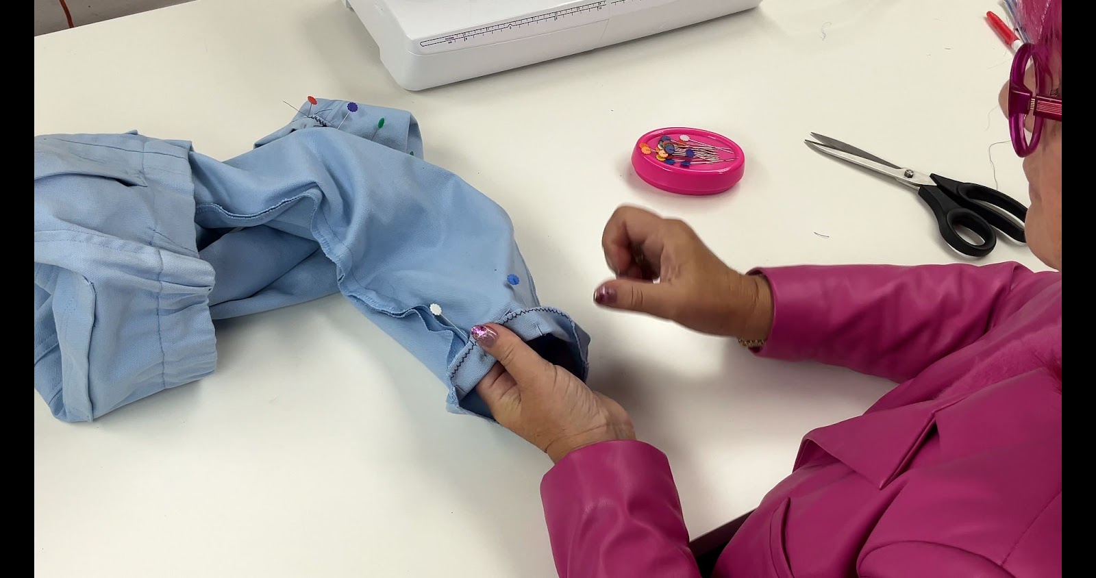 showing you how to properly pin your fabric for a pants hem