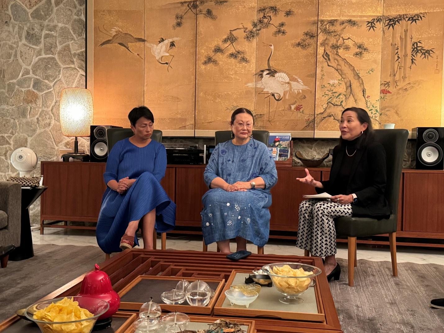 A group of women sitting in a room