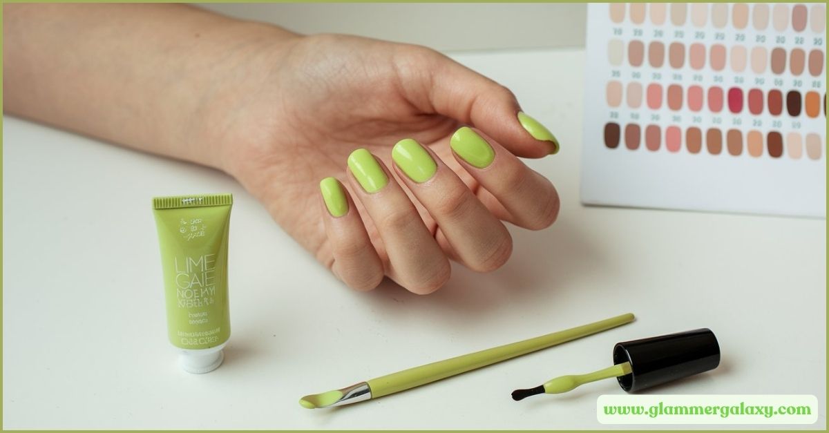 Hand displaying lime green nail polish, bottle, and swatch chart 