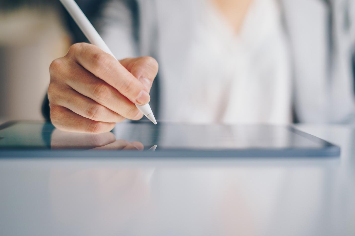 Person using tablet and digital pen