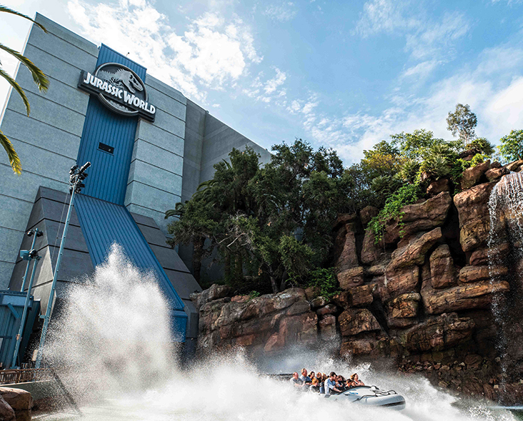 A water ride in front of a building

Description automatically generated