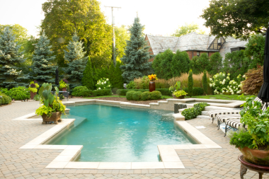 the complete guide to pool decks unique perimeter shape with greenery custom built michigan