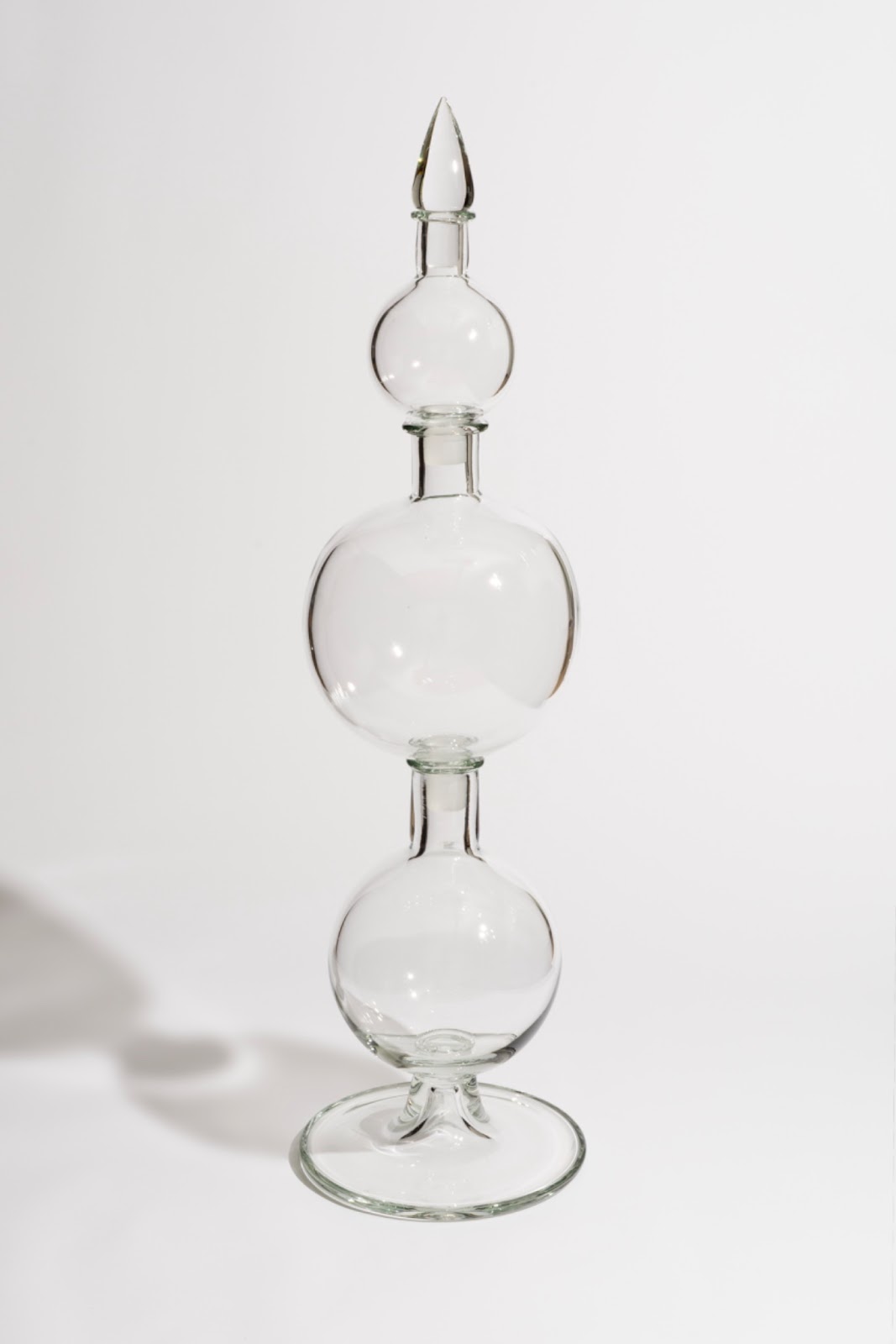 Image: "Bukang Liwayay" by Crystal Z Campbell, 2024. Hand-blown colorless glass, made at the Museum of Glass, Tacoma, WA. Three-tired oblong clear vase. Photo by Ian Lewis. Courtesy of Crystal Z Campbell.