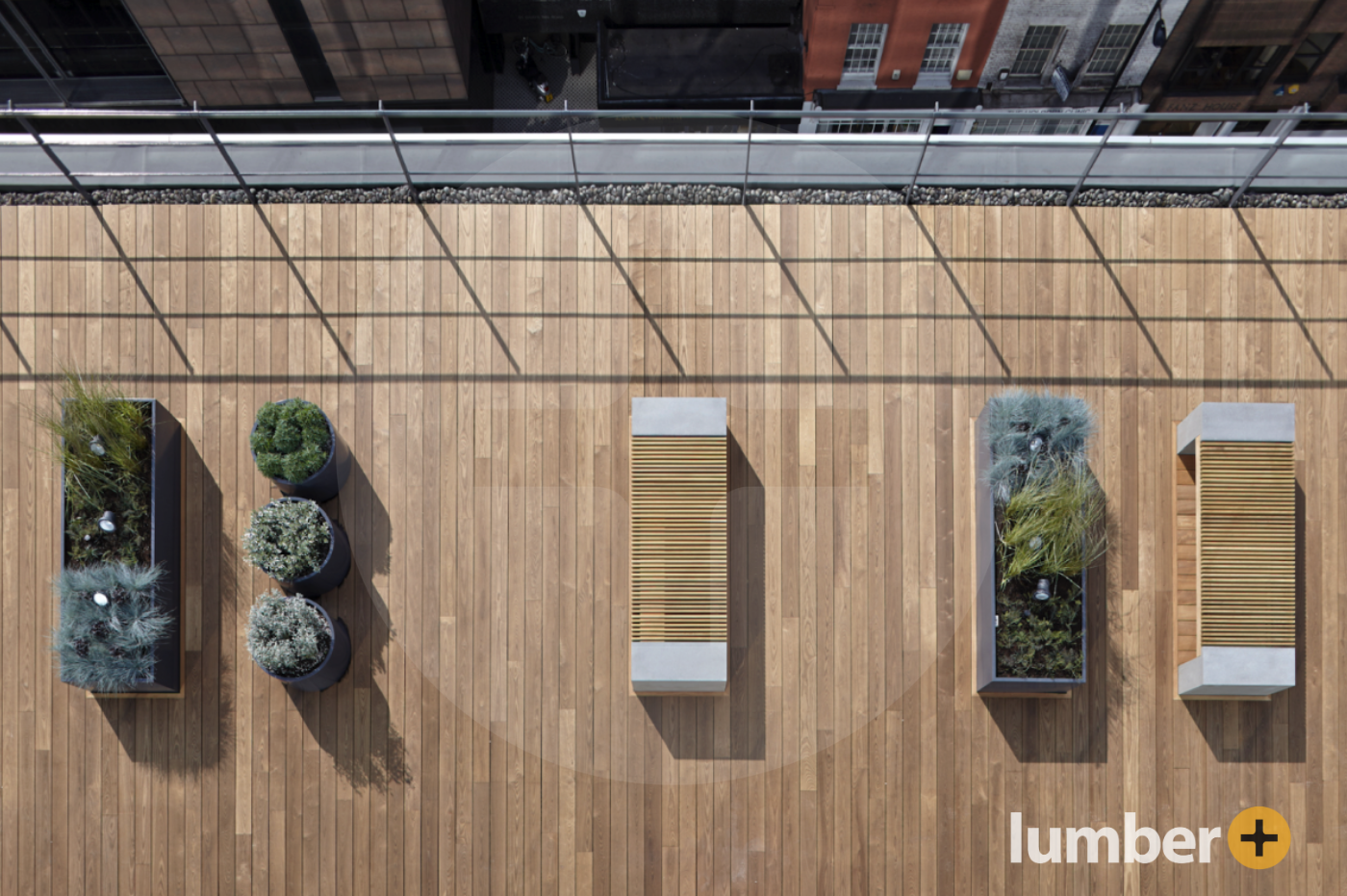 a rooftop deck made out of Thermo Ash on top of a modern commercial building