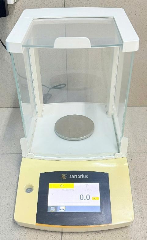 A scale with a round object on it

AI-generated content may be incorrect.