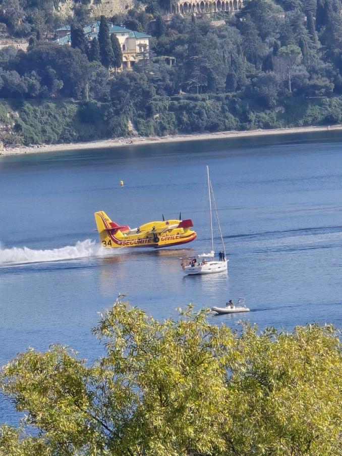 A yellow plane on water

Description automatically generated