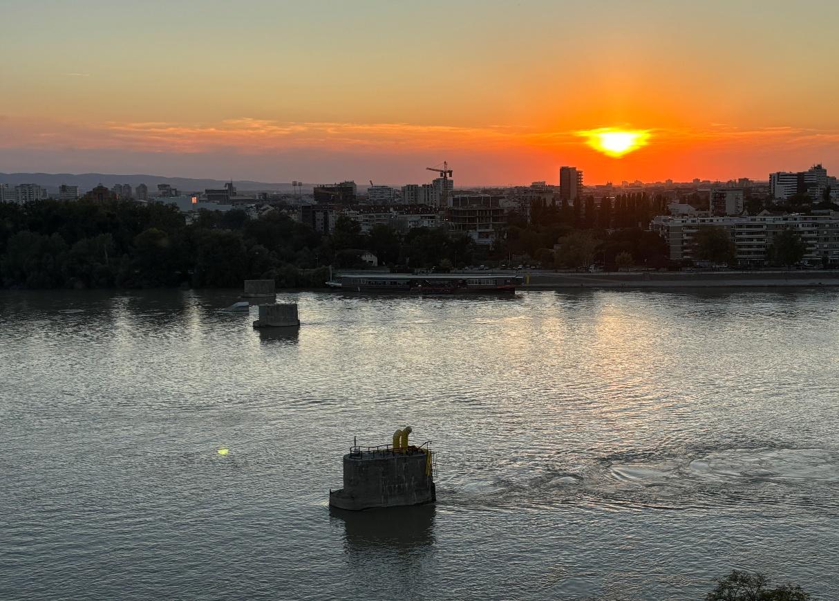 A sunset over a body of water AI-generated content may be incorrect.