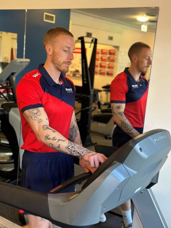 a Vision PT personal trainer using the treadmill