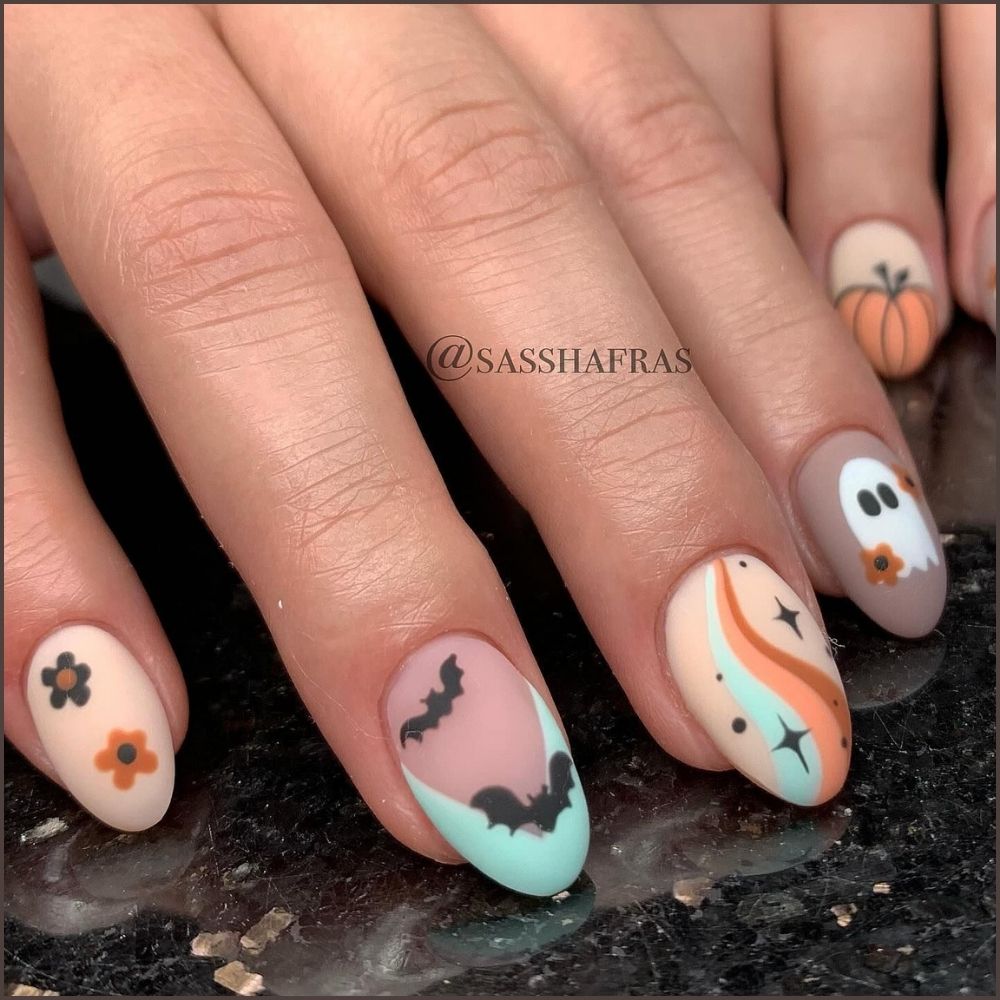 Close up of nails with spooky nails having Happy Halloween Nails