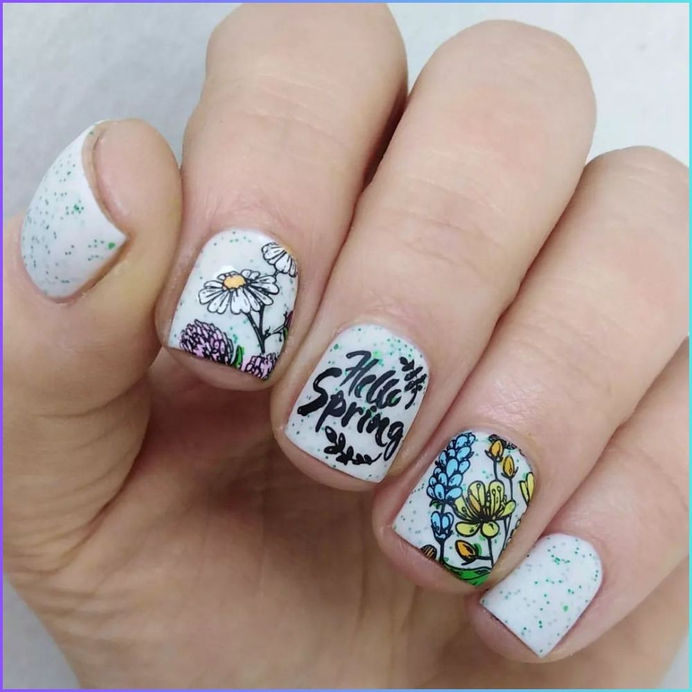 Close up of flowered short nail design with Hello spring theme