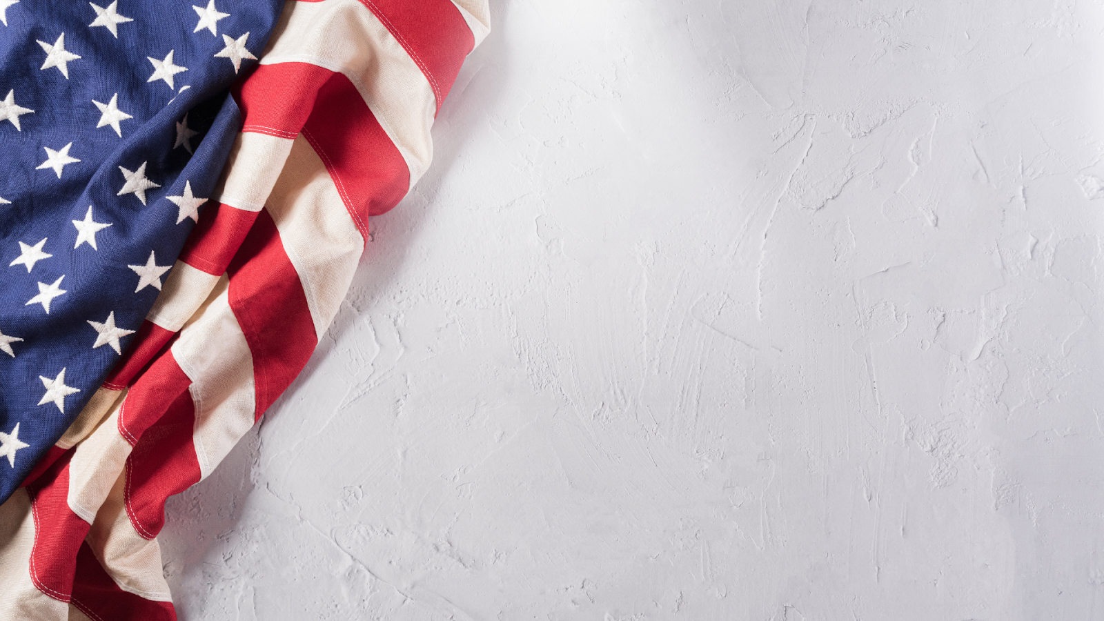 American flag on white textured wall // Healthier Veterans Today