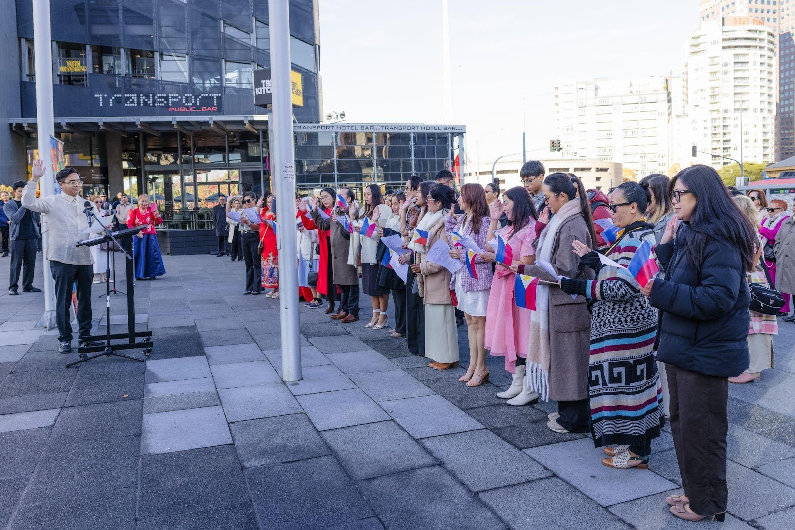 A group of people standing in a lineDescription automatically generated
