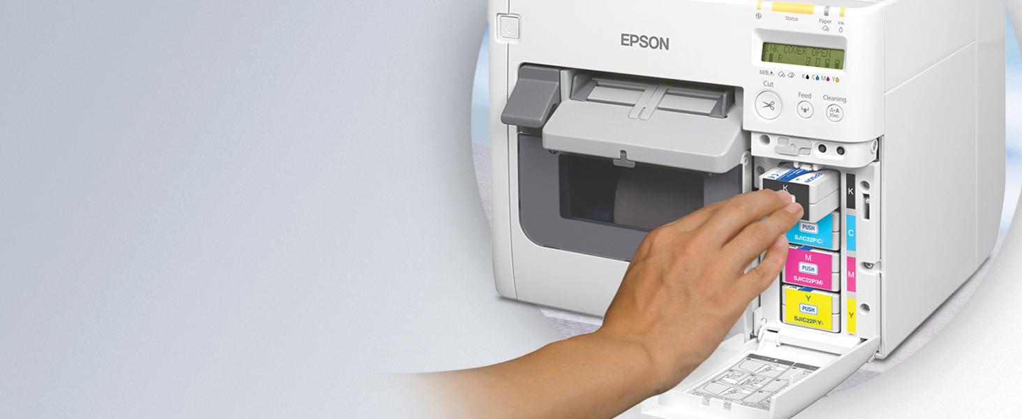 A person changing/ installing the epson c3500 ink cartridges 